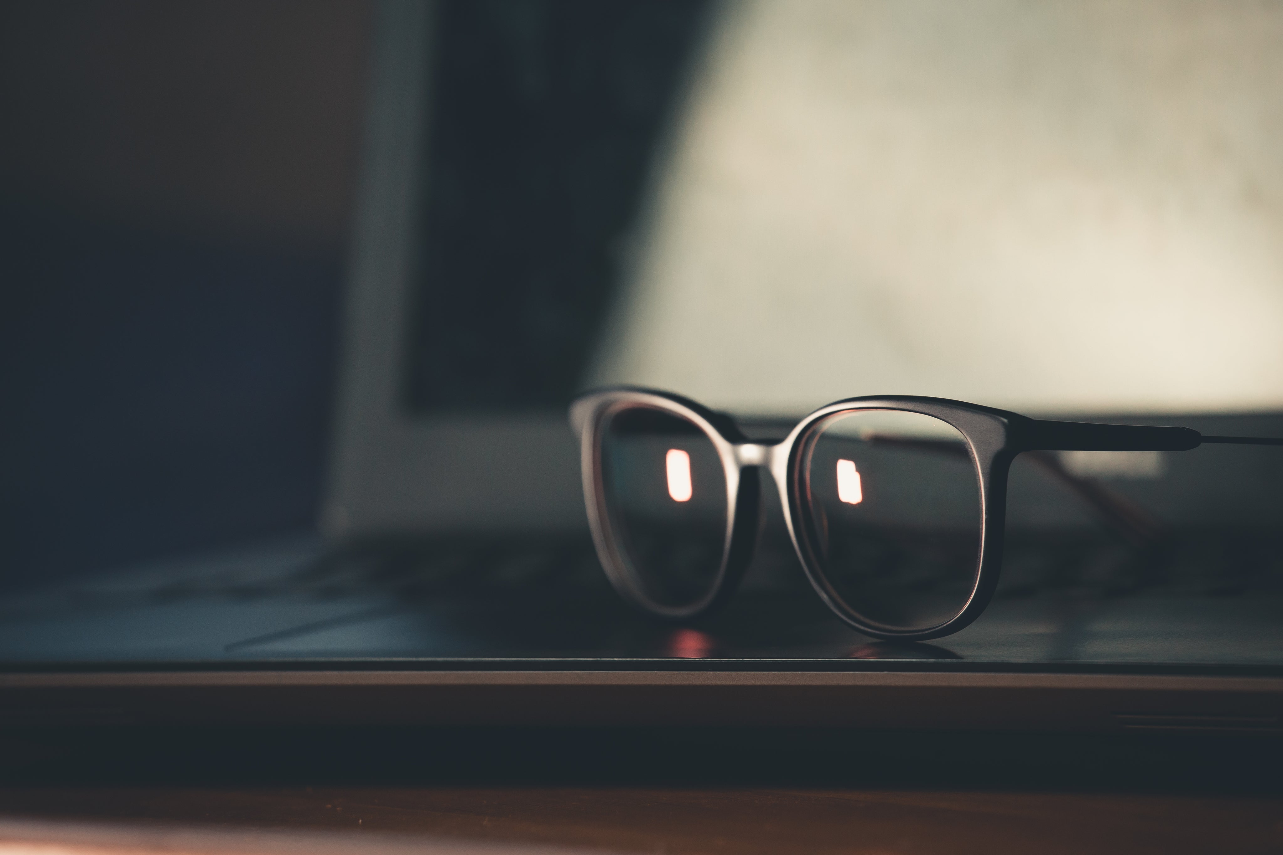black-glasses-frames-sit-up-on-surface.jpg