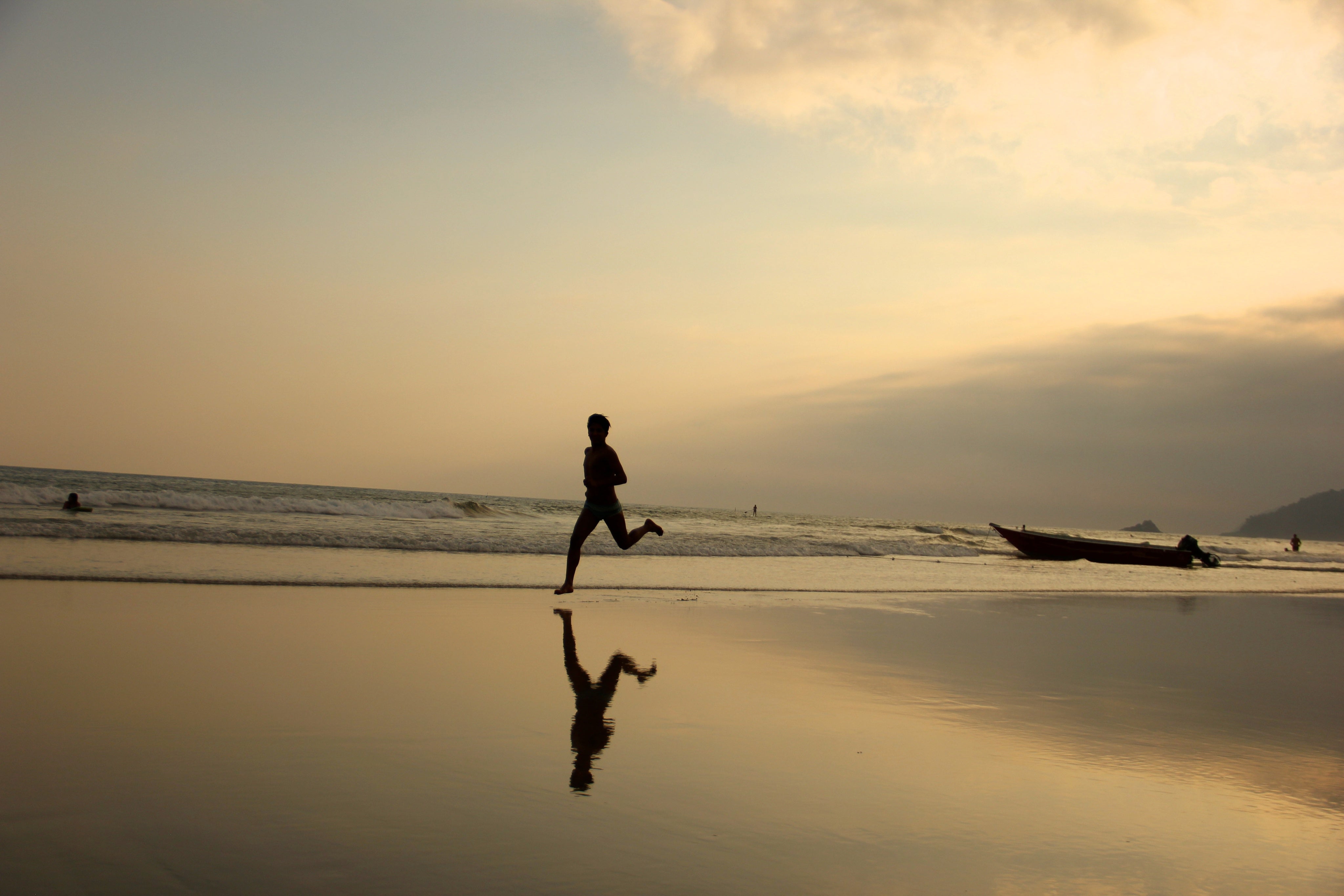 person-running-on-the-beach-under-setting-sun.jpg